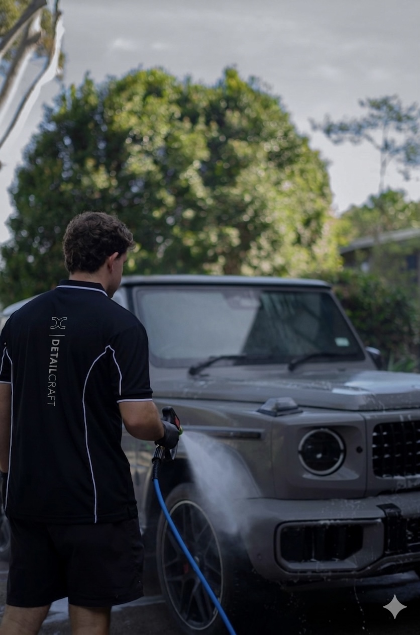 Xavier at work on a Mercedes-AMG G63, in branded Detail Craft uniform.